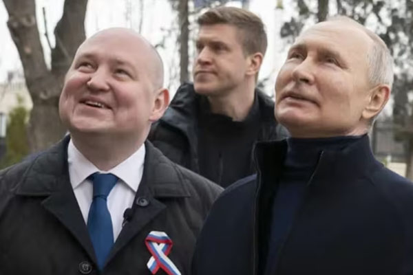 Vladimir Putin, the president of Russia, and Mikhail Razvozhayev, the governor of Sevastopol, Saturday visited the Children's Art and Aesthetic Center, a part of the Chersonesos Taurica Historical and Archeological Park. (AP Picture)