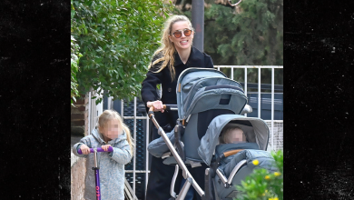 Amber Heard All Smiles as Johnny Depp Films Hollywood Return