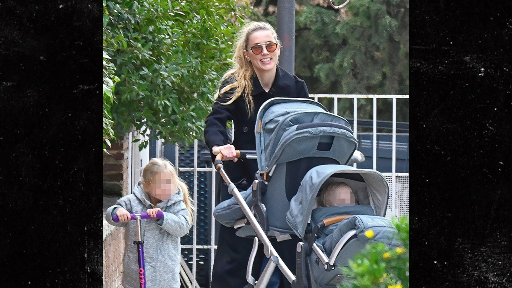 Amber Heard All Smiles as Johnny Depp Films Hollywood Return