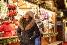 Lady browsing round a Christmas market stall