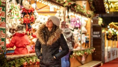 Lady browsing round a Christmas market stall