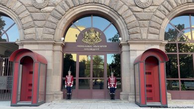 Presidential Palace in Sofia, entrance with two guard boxes on each side, two guards in ceremonial uniform in front of the door