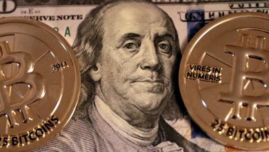 Benjamin Franklin on the $100 dollar bill with two 25 Bitcoin Casascius Gold Rounds by Gage Skidmore.jpg