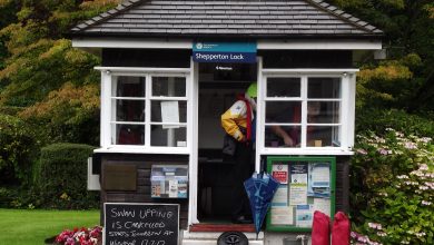 Family enjoying a day at Legoland Windsor with summer savings signage