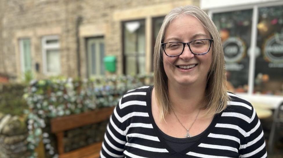Image caption, Emma Spry from UTASS, who operate a heating oil buying group for the village