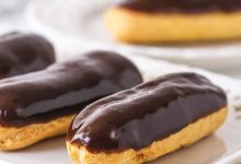 Chocolate eclairs on a white plate