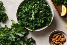 AI-generated image: A top-down view of a table with a bowl of chopped kale, almonds, a lemon, and a lemon half.