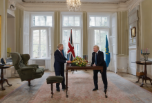 AI-generated image: Two men are standing at a wooden table.